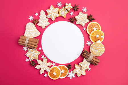 Christmas and New Year composition. Festive decorations and homemade gingerbread with copy space for text design. Holiday and celebration concept, greeting card or invitation mockupの写真素材