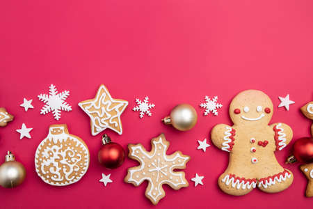 Christmas and New Year composition. Festive decorations and homemade gingerbread with copy space for text design. Holiday and celebration concept, greeting card or invitation mockupの写真素材