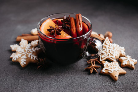 Christmas magic atmosphere, home celebration. Hot mulled wine, gingerbread and festive decorations,...