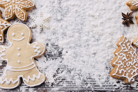 Christmas and New Year celebration traditions. Texture with homemade gingerbread cookies and spices...