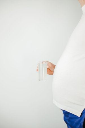 Overweight man with carbonated soda drink