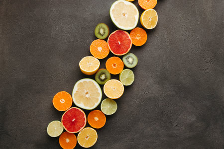Summer vibes. Tropical background, citrus border on black concrete. Summertime vacation, cocktail,...