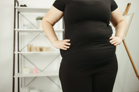 Belly fat, excessive weight, overweight concept. Woman with obese body, close up