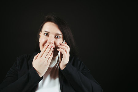 Good news, friendly conversation, communication. Happy excited woman having phone call, copy spaceの写真素材