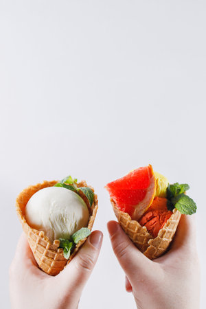 Summertime. Hands holding ice cream cones