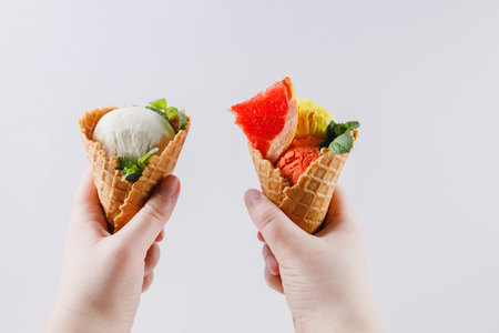 Summertime. Hands holding ice cream cones