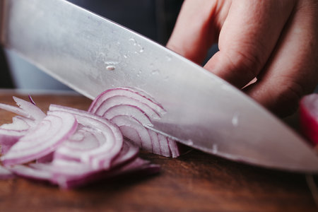 Female hands making healthy vegetable saladの写真素材