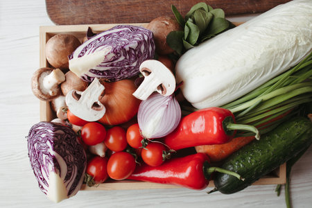 Wooden box with fresh vegetables and mushroomsの写真素材