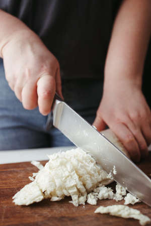 Woman preparing healthy vegetarian food in kitchenの写真素材