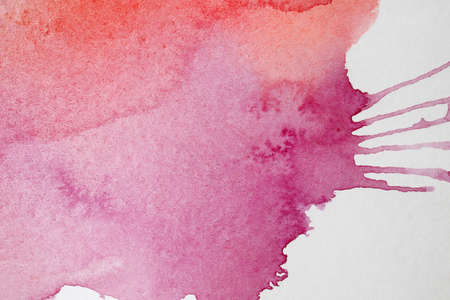 An abstract pink red watercolor splash backgroundの写真素材