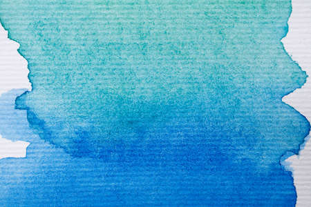 An abstract watercolor background on texture paperの写真素材