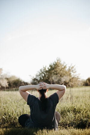 Overweight happy woman rising hands expressing joy