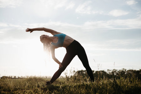 Sporty fit woman doing morning workout outdoors