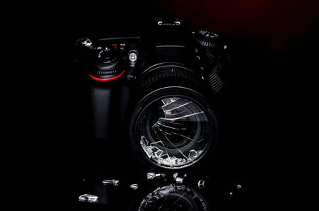 Broken DSLR photo camera filter with reflection