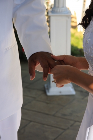 bride placing ring on groomのeditorial素材