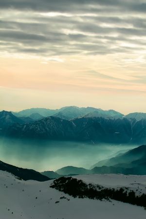 Foggy mountain scenery in Italian Dolomites at sunsetの写真素材