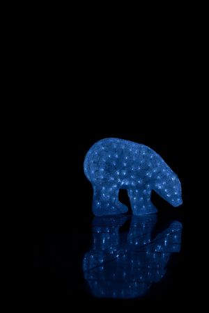 Double bear in a dark room (A lamp in a form of a bear illuminating the room)の写真素材