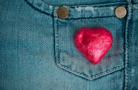 Loving jeans (A red valentine`s chocolate on jeans)の写真素材