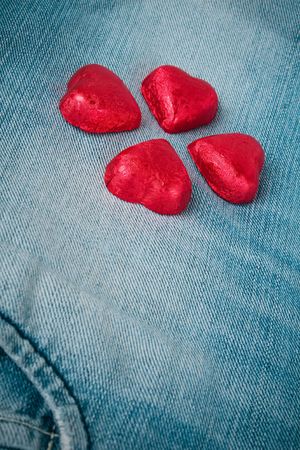 Valentine jeans (Four heart shaped chocolates on jeans)の写真素材