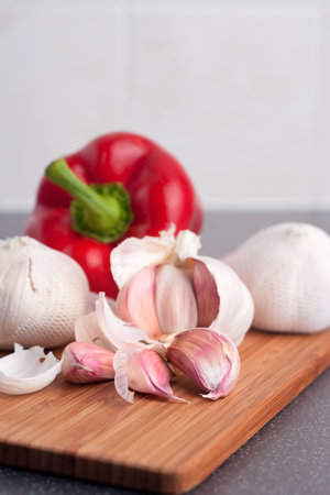 Garlic and paprica on cutting boardの写真素材