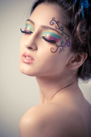 Beautiful young girl with fantasy makeupの写真素材