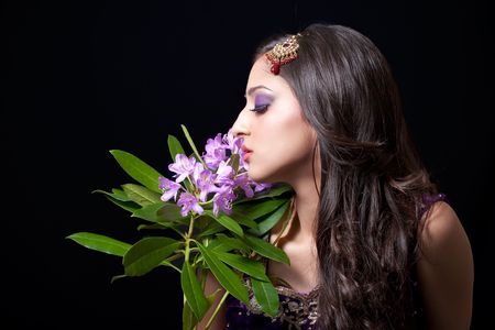 Beautiful asian bride holding flowers, isolated on blackの写真素材