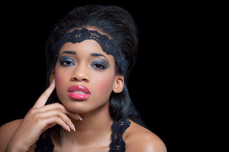 Portrait of a sensual young black woman, isolated on blackの写真素材
