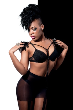 Beautiful fashion model with dark makeup wearing black lingerieの写真素材