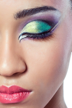 Closeup shot of a beautiful young woman's face with colorful makeupの写真素材