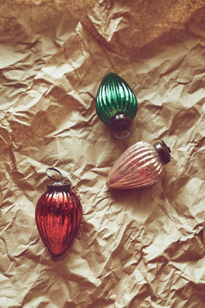 Christmas tree decorations on craft paper, top view with copy spaceの写真素材