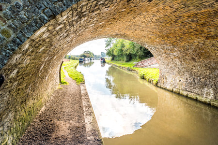 Morning view bridge over canal England United Kingdomの写真素材