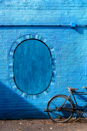 retro vintage bicycle old and blue wall background designの写真素材