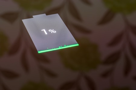 Smartphone with one percent battery charge on the screenの写真素材