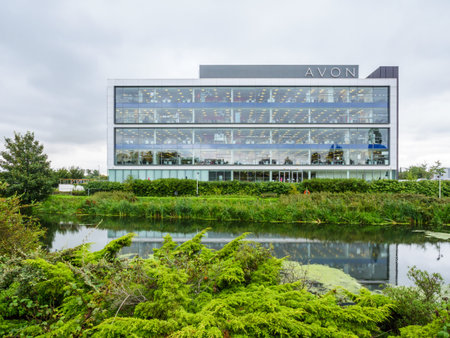 Northampton, UK - Aug 21, 2017: Cloudy day view of Avon Head Offices next to Nene Riverのeditorial素材