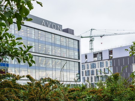 Northampton, UK - Aug 21, 2017: Cloudy day view of Avon Head Offices next to Nene Riverのeditorial素材
