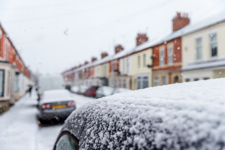 Snow covers England streets during short winterの写真素材