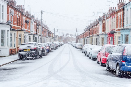 Snow covers England streets during short winterの写真素材