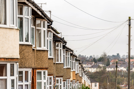 Typical row of houses in British city on cloudy dayの写真素材