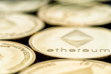 Closeup view Ethereum cryptocurrency coins laid flatの写真素材