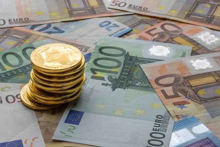 Ethereum coins stacked on Euro notes, future concept financial currency, crypto currency signの写真素材