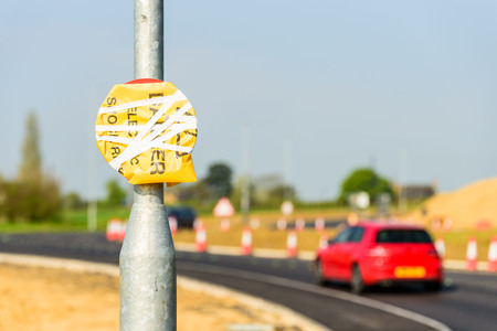 Hidden Speed Limit Road Roadworks sign on UK motorwayの写真素材