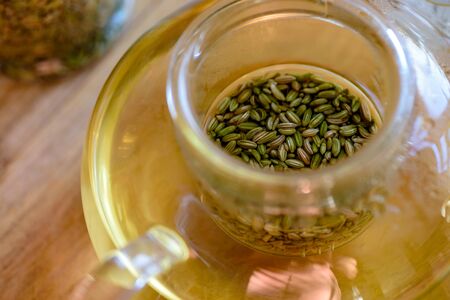 fennel seeds inside glass teapot being brewed for healthy drinkの写真素材