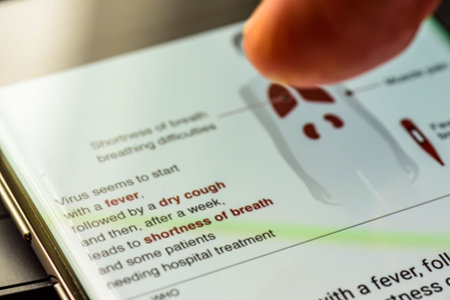 coronavirus covid 19 symptoms on smart phone screen - Northampton, UK - February 25, 2020