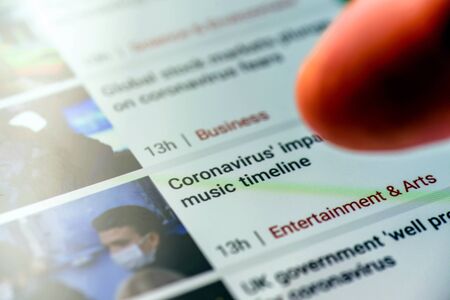 coronavirus impact on music timeline text on smart phone screen - Northampton, UK - February 25, 2020のeditorial素材