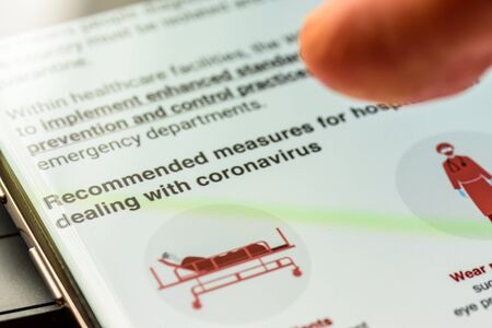 coronavirus covid 19  text on smart phone screen - Northampton, UK - February 25, 2020のeditorial素材