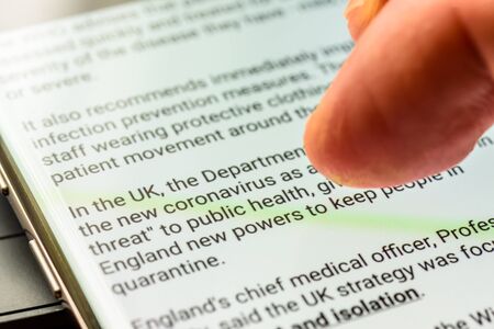 coronavirus covid 19  news text on smart phone screen - Northampton, UK - February 25, 2020のeditorial素材
