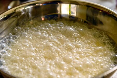 pancake crepe mix inside metal bowl closeupの写真素材