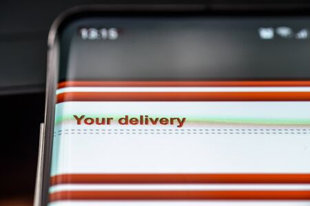 your delivery text on smart phone screen.の写真素材