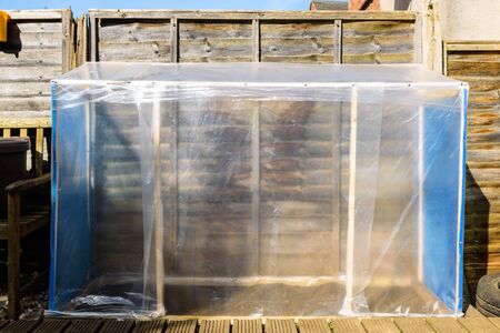 handmade greenhouse in back garden in england ukの写真素材