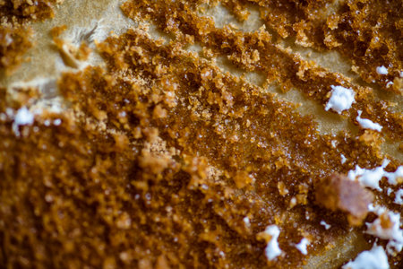fork knife and spoon covered with apple pie icing on empty baking paper tray